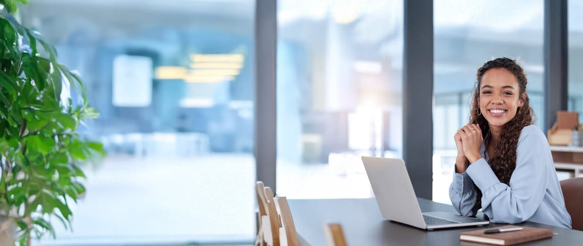Smiling woman sitting at desk